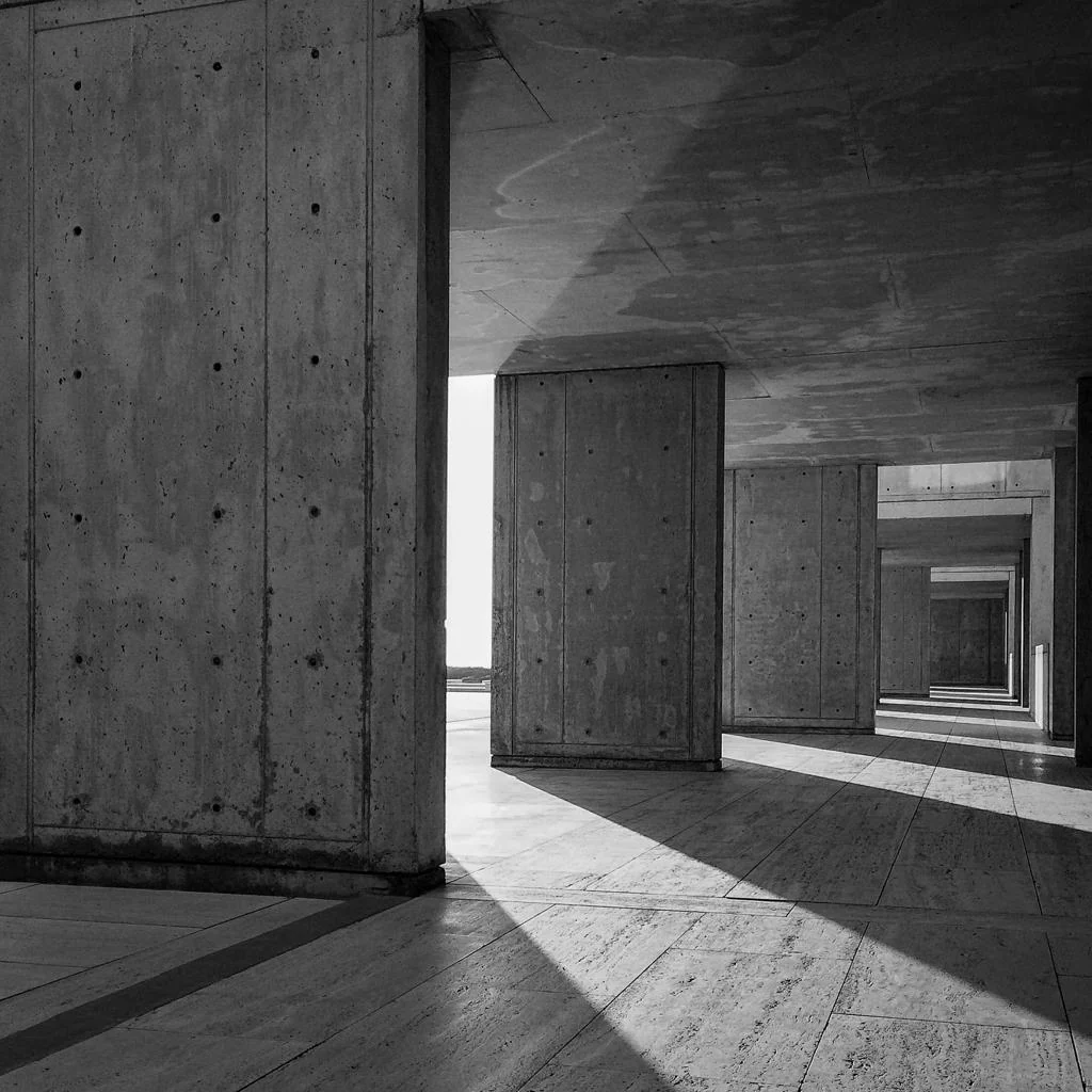 Light falling through a sequence of concrete doorways